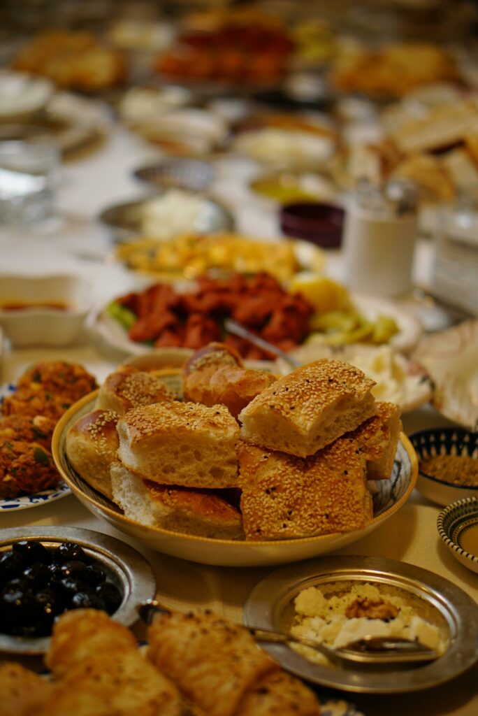 A rich and inviting Iftar meal spread featuring traditional Turkish dishes and breads.